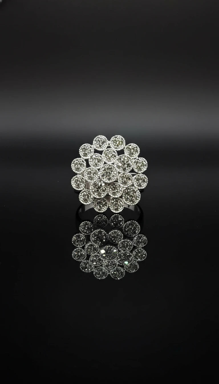 Silver ring with cluster design featuring multiple round-cut diamonds arranged in a floral pattern.